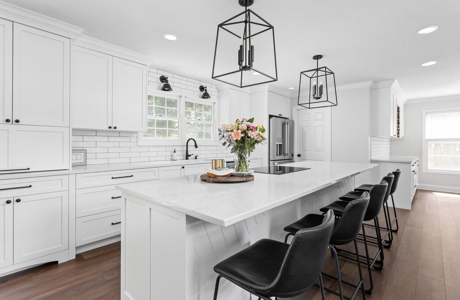 An all-white kitchen with bright white painted cabinets.