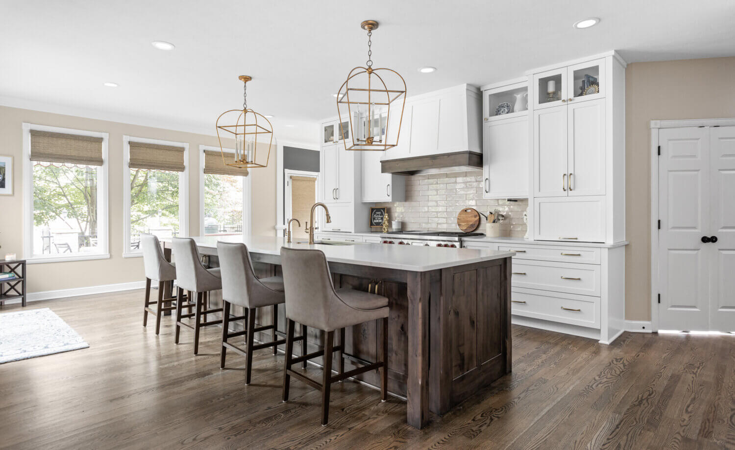 A timeless kitchen design with two-tone cabinets in white paint and dark stained knotty alder cabinets.