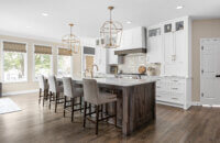 A timeless kitchen design with two-tone cabinets in white paint and dark stained knotty alder cabinets.