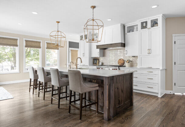 A timeless kitchen design with two-tone cabinets in white paint and dark stained knotty alder cabinets.