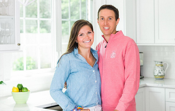 Happy couple enjoys their new kitchen cabinets from Dura Supreme.