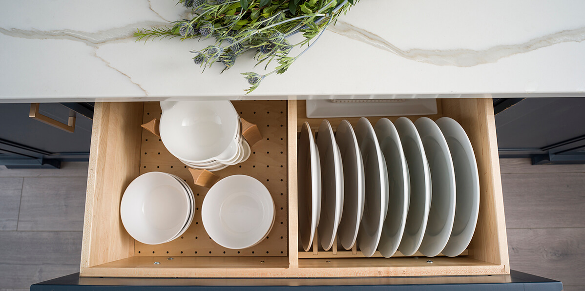 A dish rack and plate rack drawer for plateware storage.