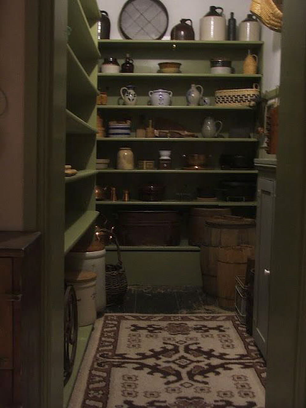 An old-fashioned walk-in pantry room.
