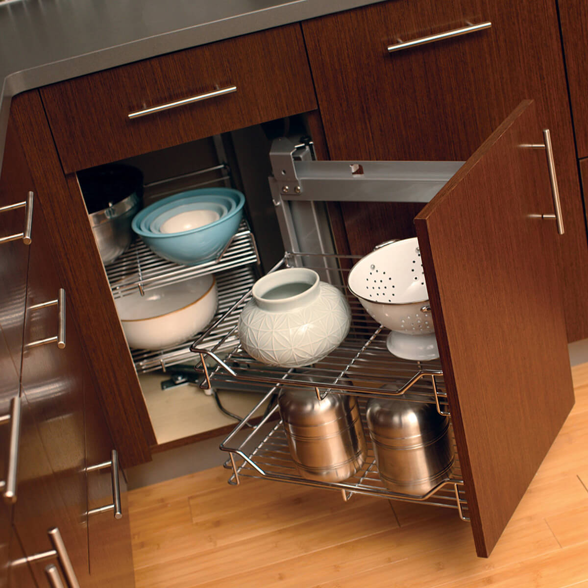 Pull-out corner storage racks in a base cabinet from Dura Supreme Cabinetry.