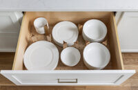 A deep drawer with a dish rack drawer for plates and bowls.