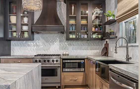 A beautiful two-tone kitchen with dark stained and light stained quarter-sawn white oak rift-sawn cabinets.