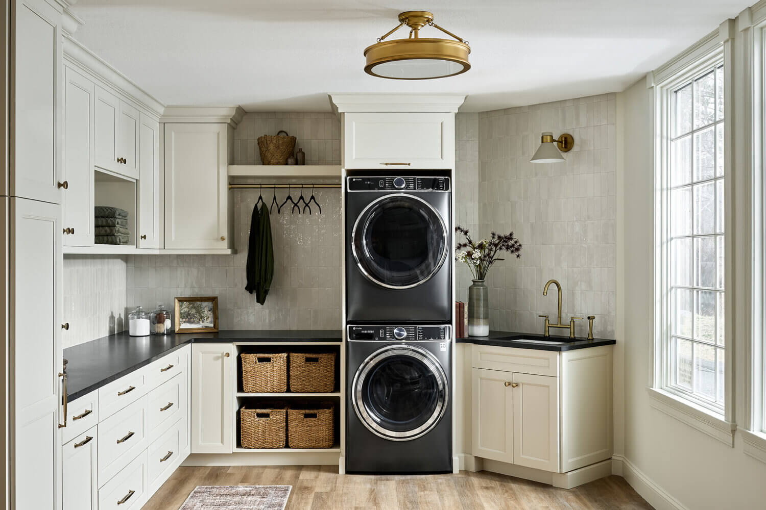 A beautiful laundry room with painted cabinets from Dura Supreme.
