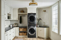A beautiful laundry room with painted cabinets from Dura Supreme.