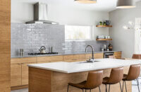 A modern, Asian Zen styled kitchen design with natural bamboo cabinets with a sleek slab door style.