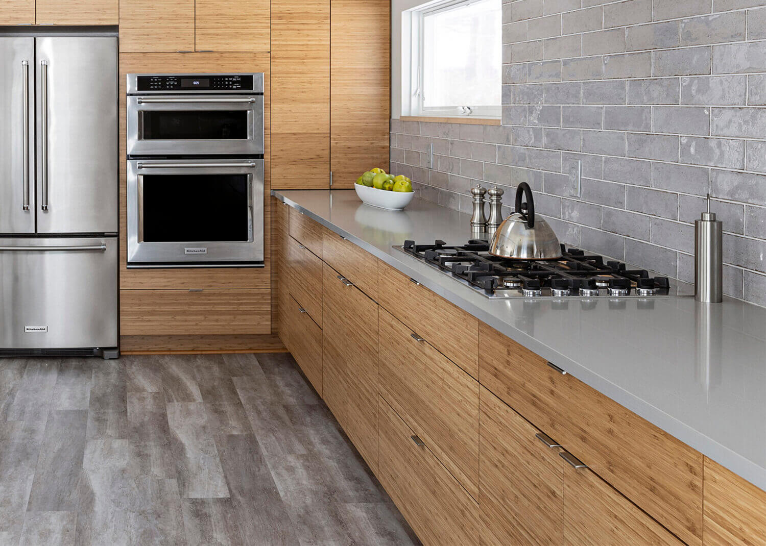 A close up of the horizontal grain pattern on the natural bamboo kitchen cabinets from Dura Supreme Cabinetry.