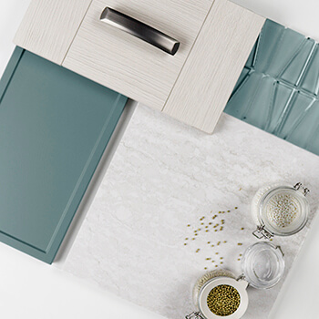 A modern kitchen design mood board with contemporary textured cabinet door with a three panel design paired with a light blue matte foil finish on a skinny shaker door style.