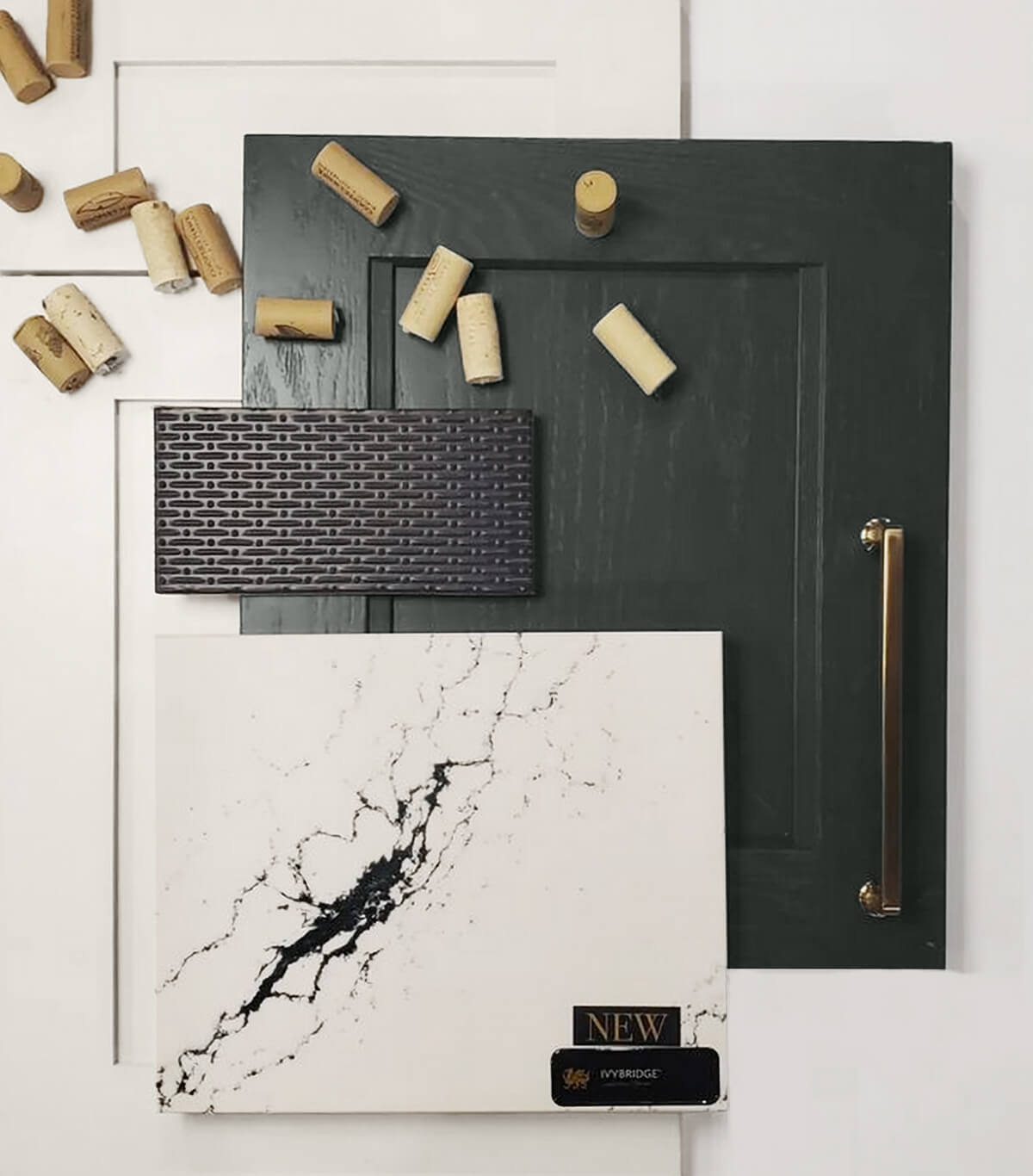 A kitchen design mood board featuring a dark green painted oak cabinet door that shows the wood texture through the painted finish.