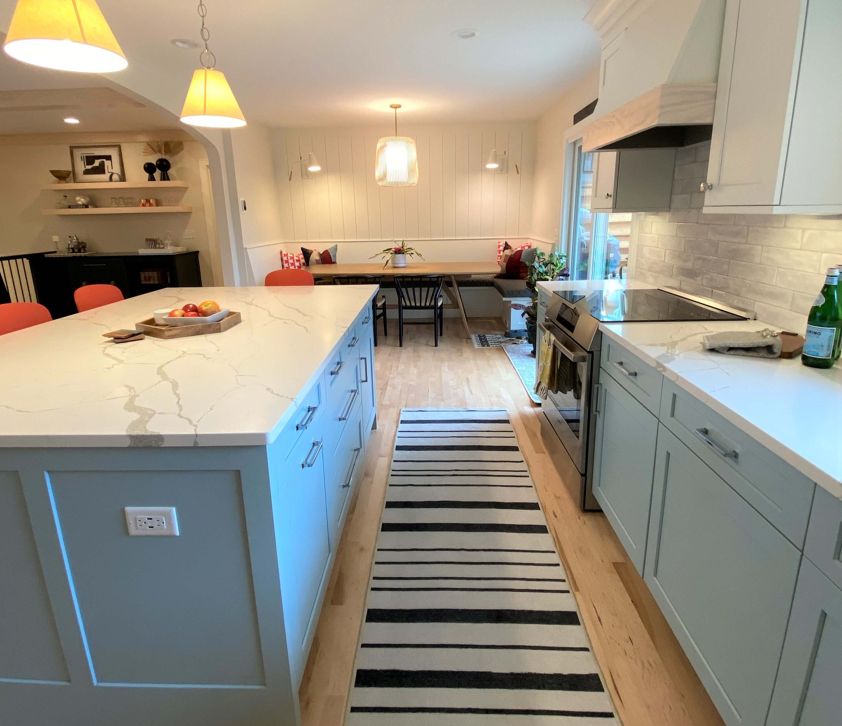 A view of the white and light blue kitchen with two custom paint colors.