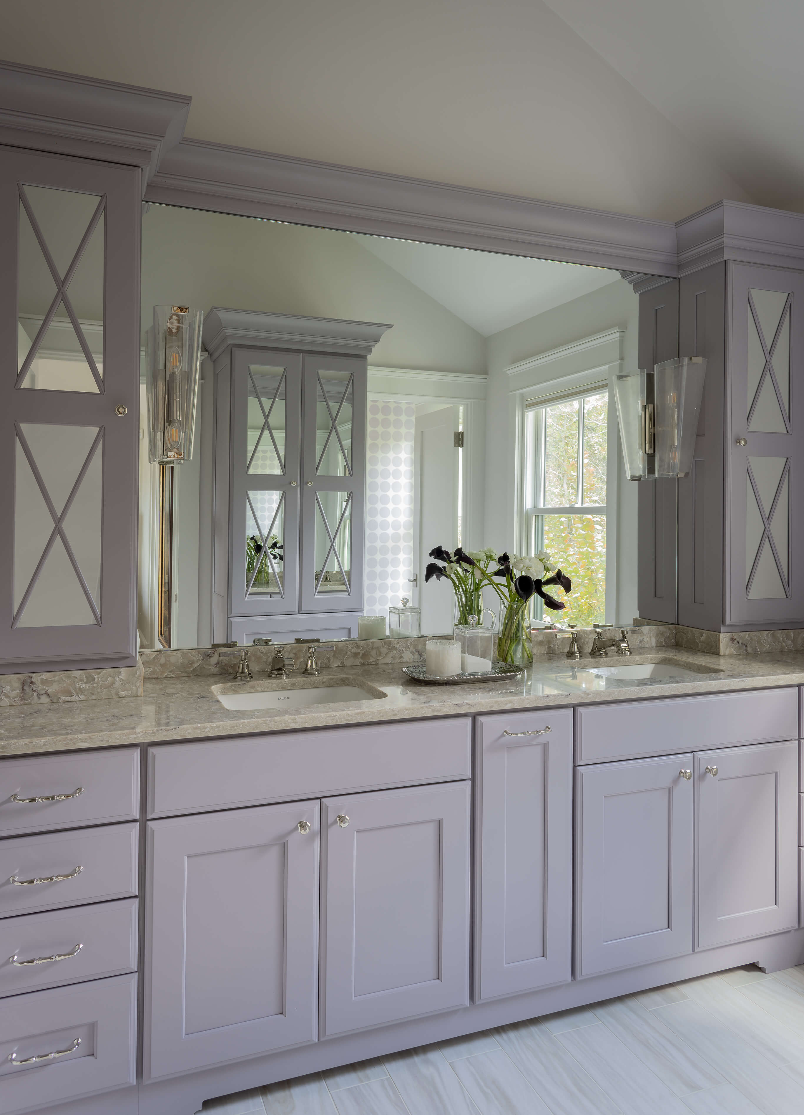 A mauve painted vanity with mirror cabinet doors from Dura Supreme.
