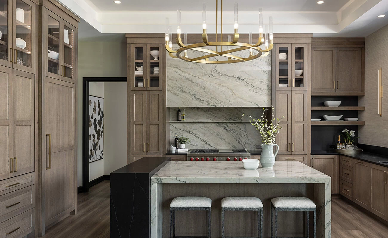 A modern prairie styled home with modern farmhouse features and medium stained wood cabinets.