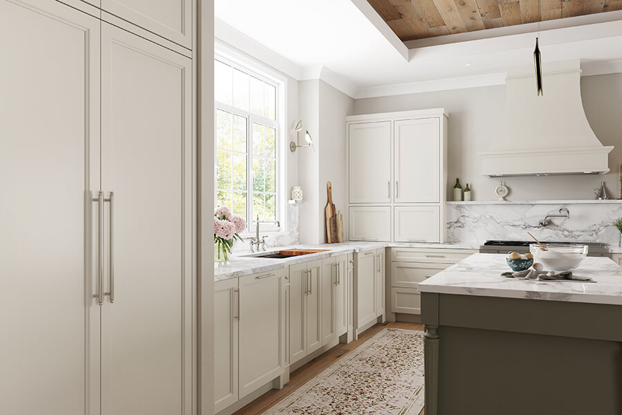 An American framed kitchen with painted inset cabinets from Dura Supreme with a muted white color.