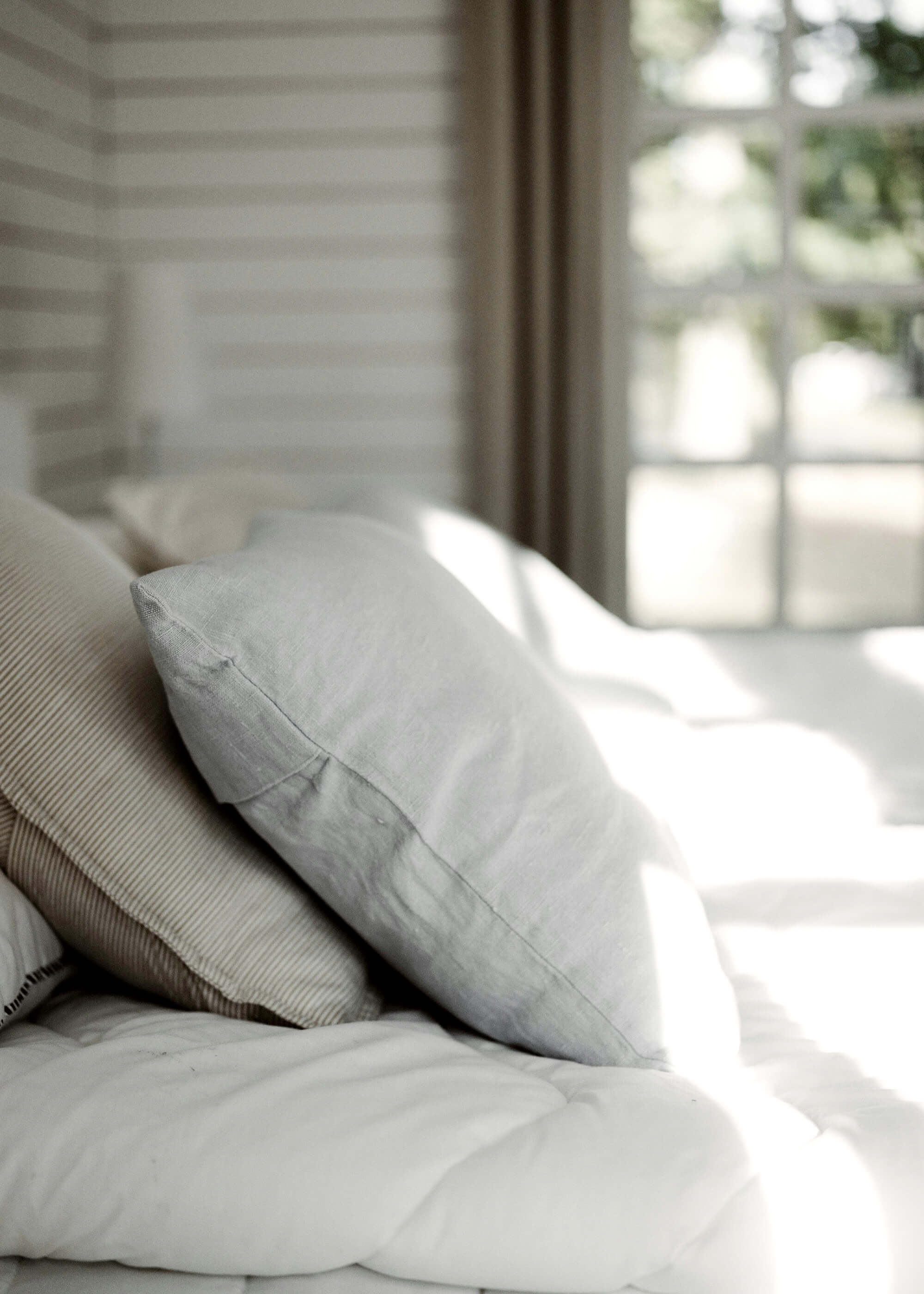 Modern farmhouse bedroom with natural and organic fabrics.