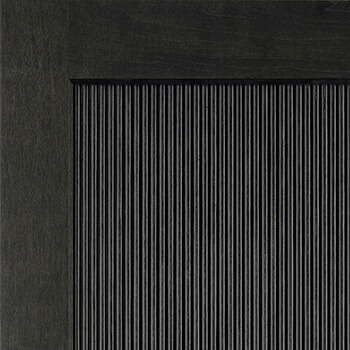 A dark stained Reeded Panel cabinet door with a delicate texture.