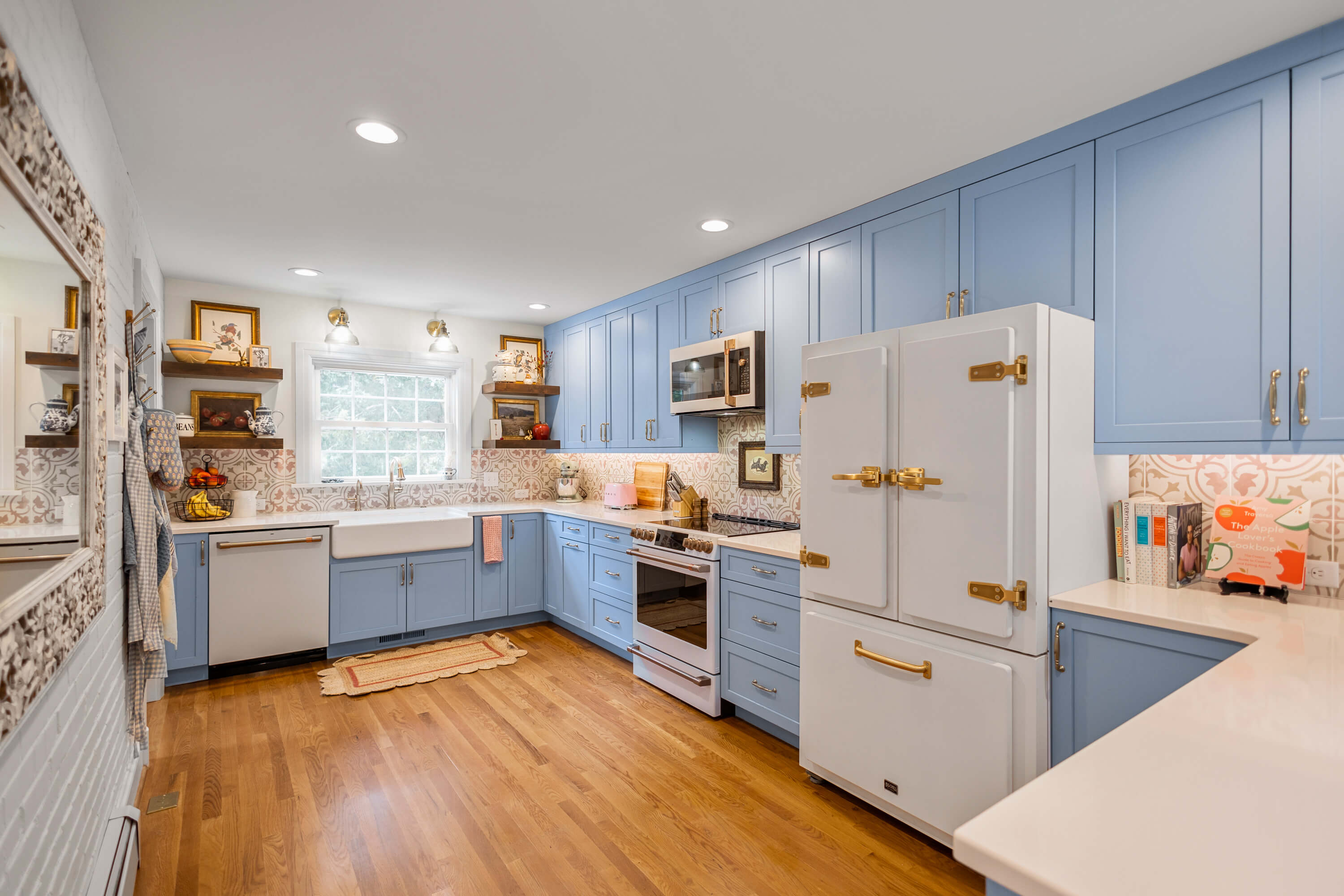 A soft baby blue kitchen remodel with vintage style and custom blue painted cabinets.