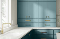 An ocean blue kitchen with contemporary slab cabinet doors featuring a state-of-the-art matte cabinet finish.