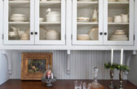 Light gray painted cabinets with inset cabinets for the wall cabinets and full overlay for the base cabinets to create a hutch like look.
