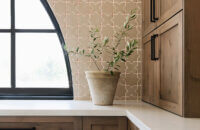 With an emphasis on comfort, heritage-inspired details, and lived-in textures, this family home is a Mediterranean oasis. This stunning Mediterranean inspired home features Dura Supreme’s Hudson shaker door style in a combination of the “Cashew” stain on Knotty Alder