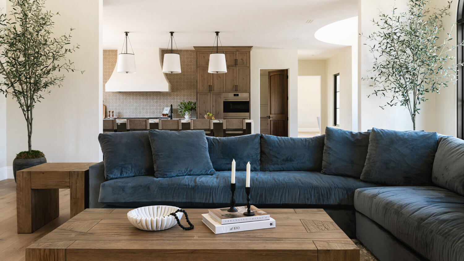 With an emphasis on comfort, heritage-inspired details, and lived-in textures, this family home is a Mediterranean oasis. This stunning Mediterranean inspired home features Dura Supreme’s Hudson shaker door style in a combination of the “Cashew” stain on Knotty Alder