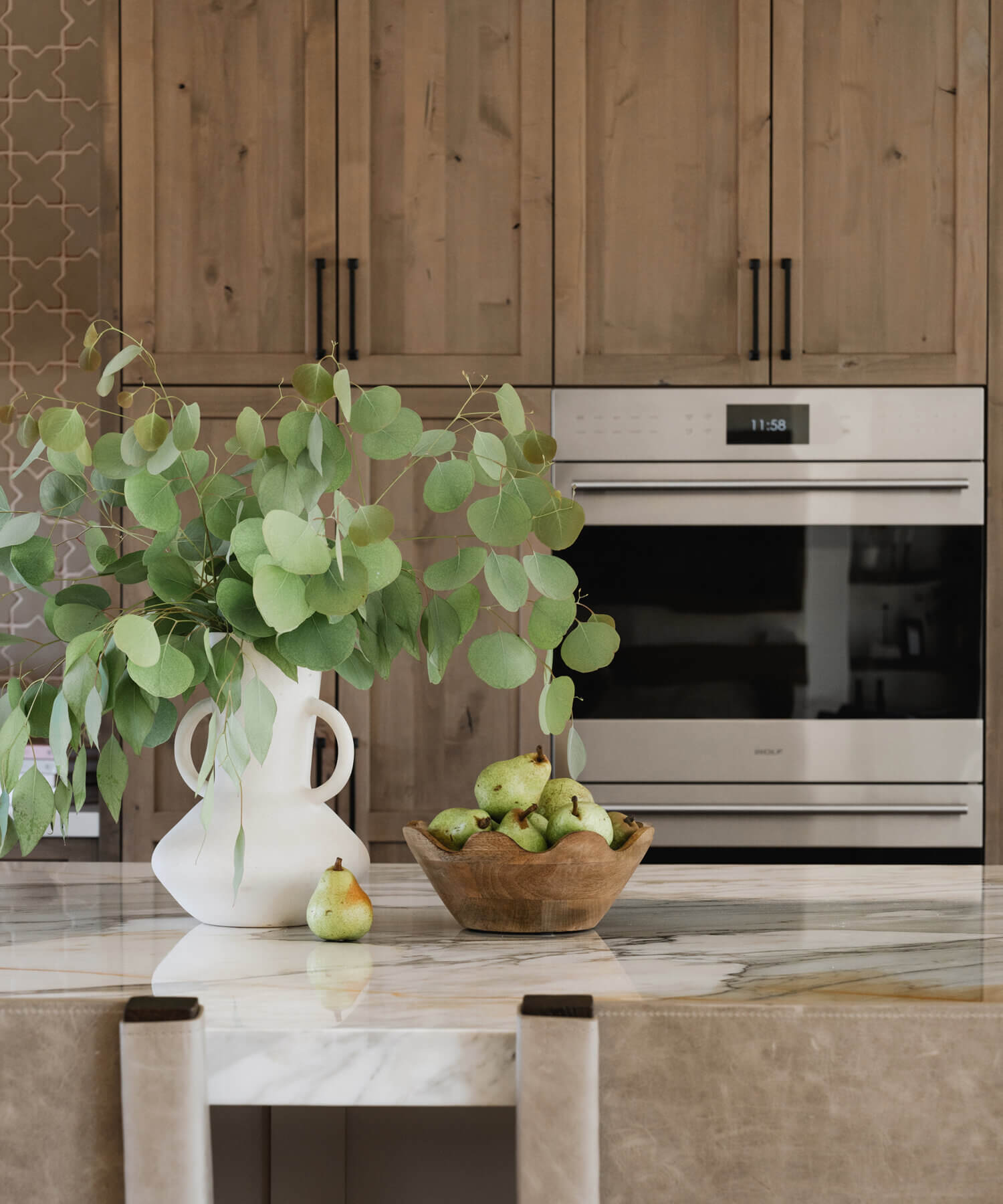 With an emphasis on comfort, heritage-inspired details, and lived-in textures, this family home is a Mediterranean oasis. This stunning Mediterranean inspired home features Dura Supreme’s Hudson shaker door style in a combination of the “Cashew” stain on Knotty Alder
