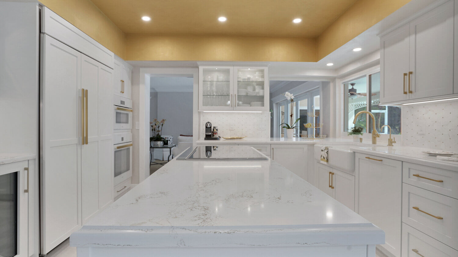 This bright white kitchen features Dura Supreme Cabinetry’s Homestead Panel door style in “White” paint paired with white countertops & backsplash with a golden ceiling and gold hardware pulls.