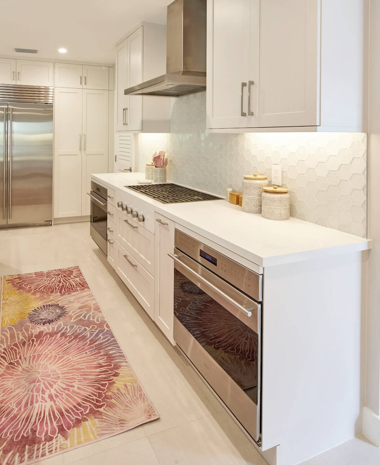 Modern, crisp paint finishes collide with natural, rustic, knotty alder in this transitional style kitchen remodel. The kitchen cabinets use Dura Supreme Cabinetry’s Hudson door style in Knotty Alder with a “Natural” finish for the kitchen island contrasted with the “Dove” paint for the perimeter.
