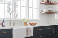 This kitchen is a great example of the latest trend of deep, earthy green cabinetry. Deep green hues are making their way into home interiors.