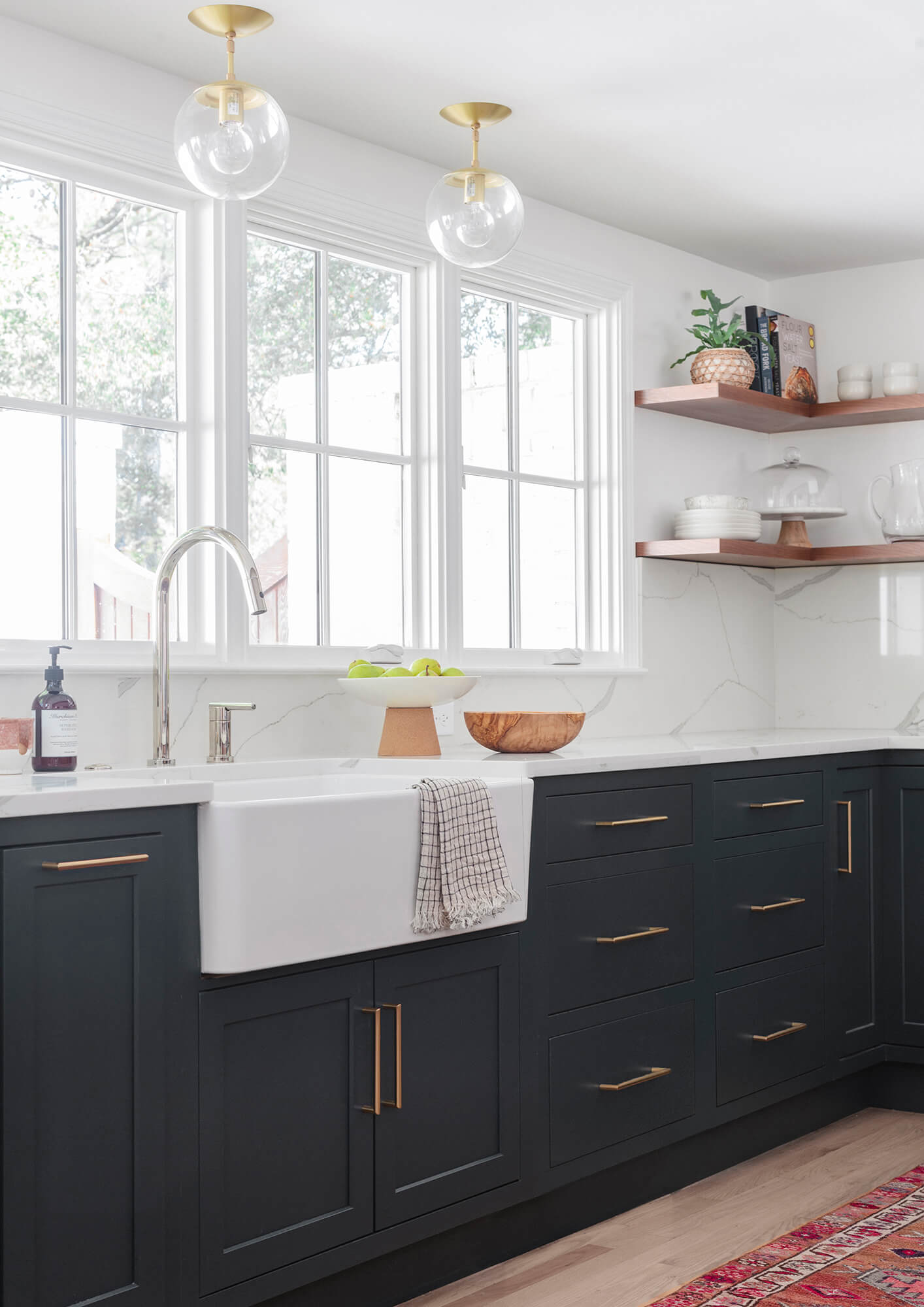 This kitchen is a great example of the latest trend of deep, earthy green cabinetry. Deep green hues are making their way into home interiors.