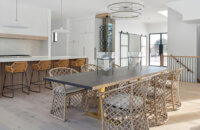 The dining room looking into the new construction modern farmhouse kitchen.