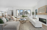 A modern farmhouse living room with cozy decor and seating.