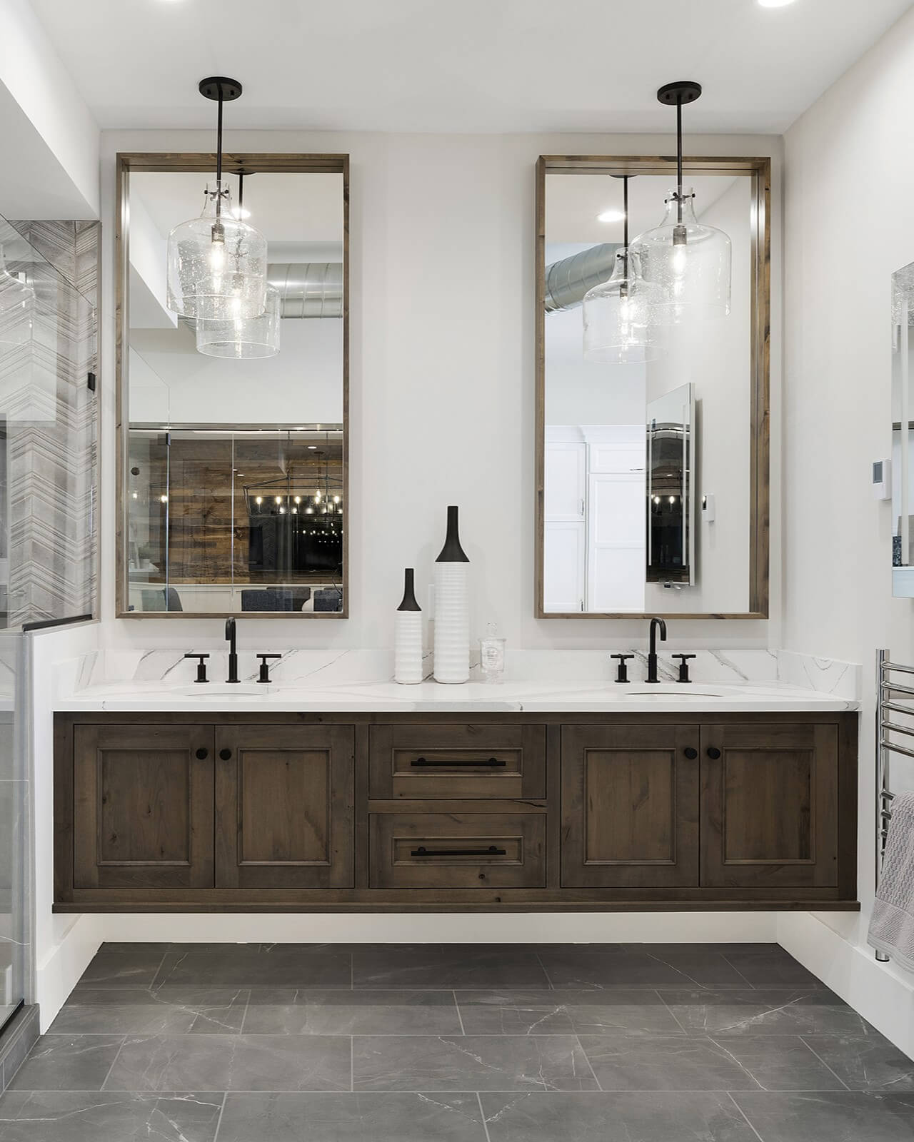 A modern floating vanity with transitional styling and interior decor showcasing a shaker door style with inset construction with a dark stained Knotty Alder wood.