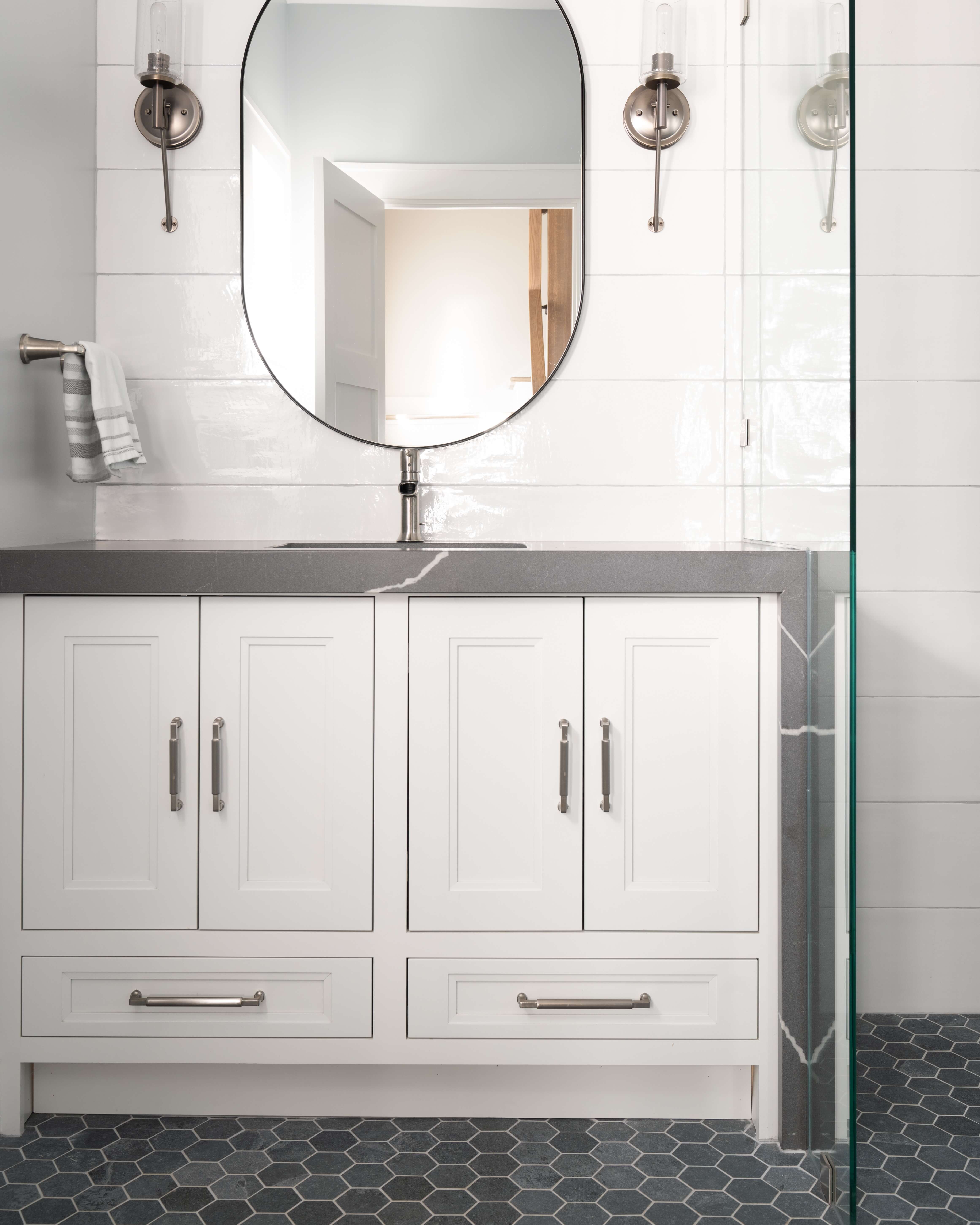 A transitional, casual styled inset vanity with a white painted finish.