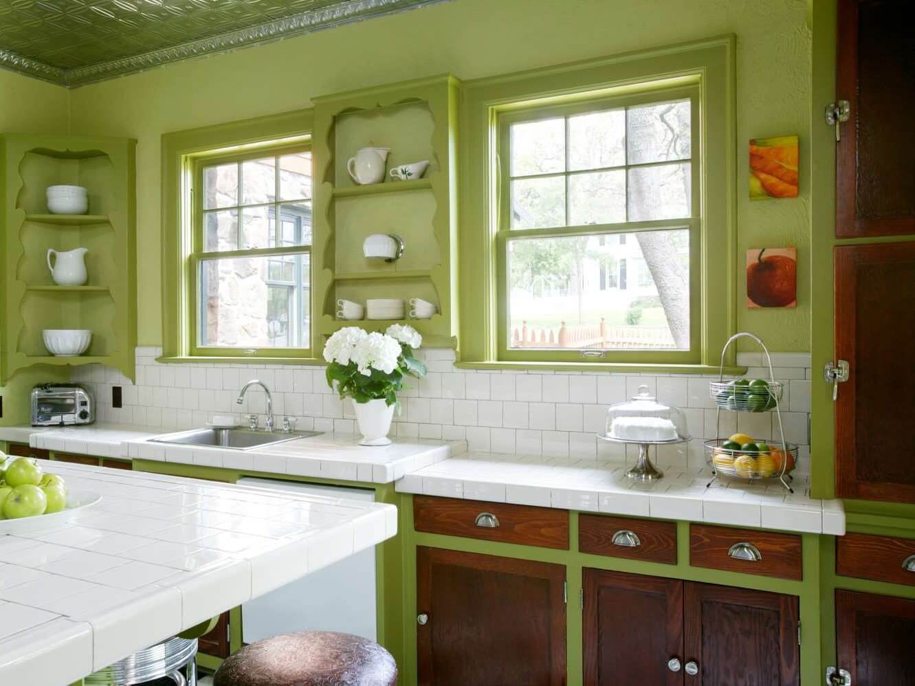 A colorful, two-tone 1950s kitchen design showing the historic evolution of inset cabinetry and how the cabinet construction method changed throughout the years.