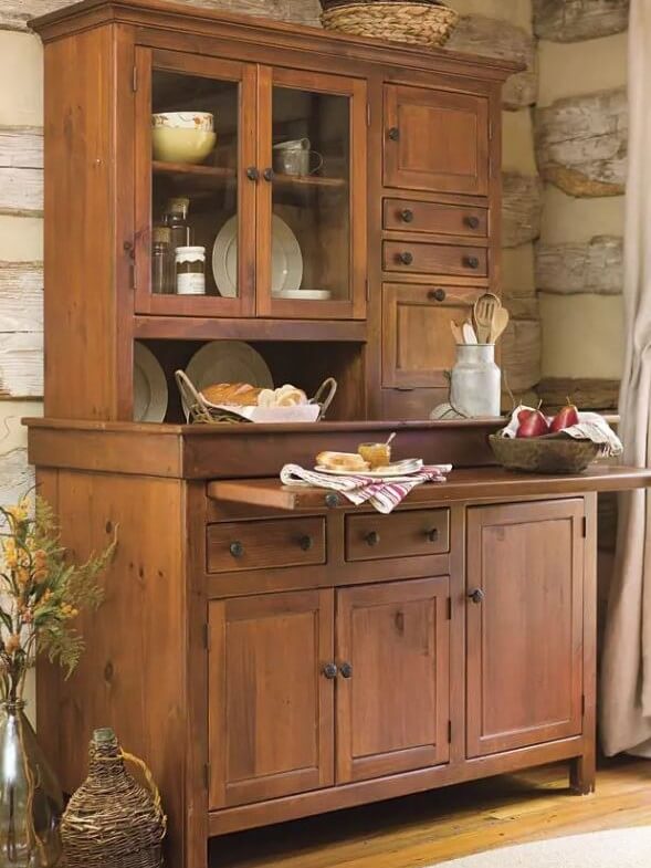 A historic replica example of the original Hoosier style cupboard with inset cabinet door construction showing the history of inset cabinetry.