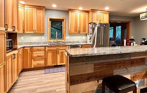 A traditional and rustic style kitchen remodeled with Dura Supreme Cabinets sharing the homeowner's cabinet testimony.