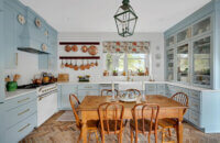 A light, baby blue kitchen design with a classic cottage style.