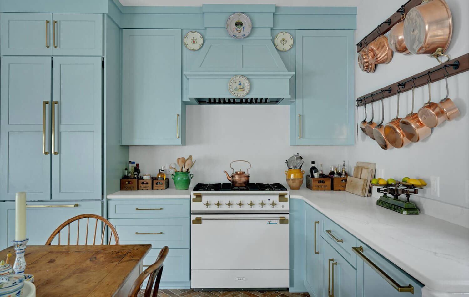 A light, baby blue kitchen design with a classic cottage style.