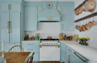 A light, baby blue kitchen design with a classic cottage style.
