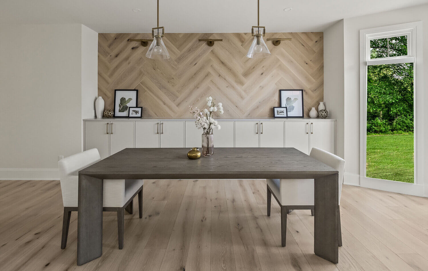 A contemporary dining room with clean lines and skinny shaker cabinets in a natural, off-white paint color.