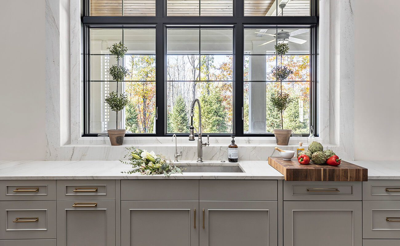 A classic kitchen design with elegant painted cabinets by Dura Supreme Cabinetry.