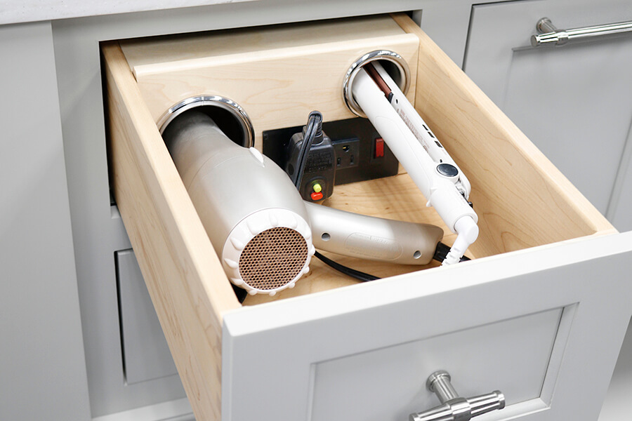 Kitchen design trends are using more integrated technology like this vanity grooming drawer for charging and powering electronic devices in a bathroom vanity drawer like hair dryers, curling irons, electric shavers, etc. Interior design trends take longer to develop than fashion trend but they also remain relevant for a longer period of time.