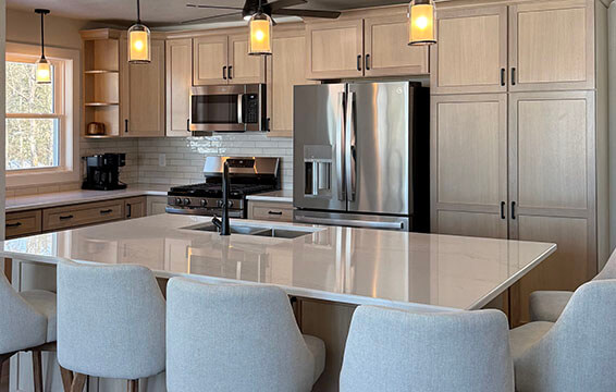 A beautiful quarter-sawn white kitchen with shaker style cabinets.